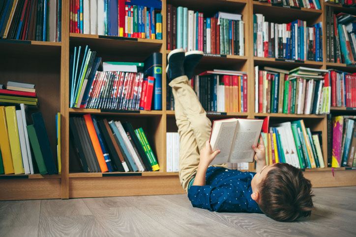 boy in classroom library